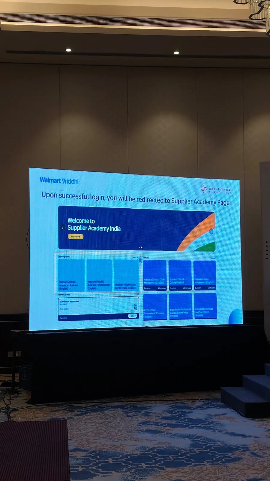 Corporate conference with attendees and stage setup