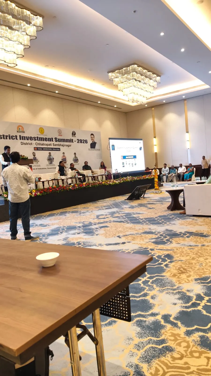 Corporate conference with attendees and stage setup