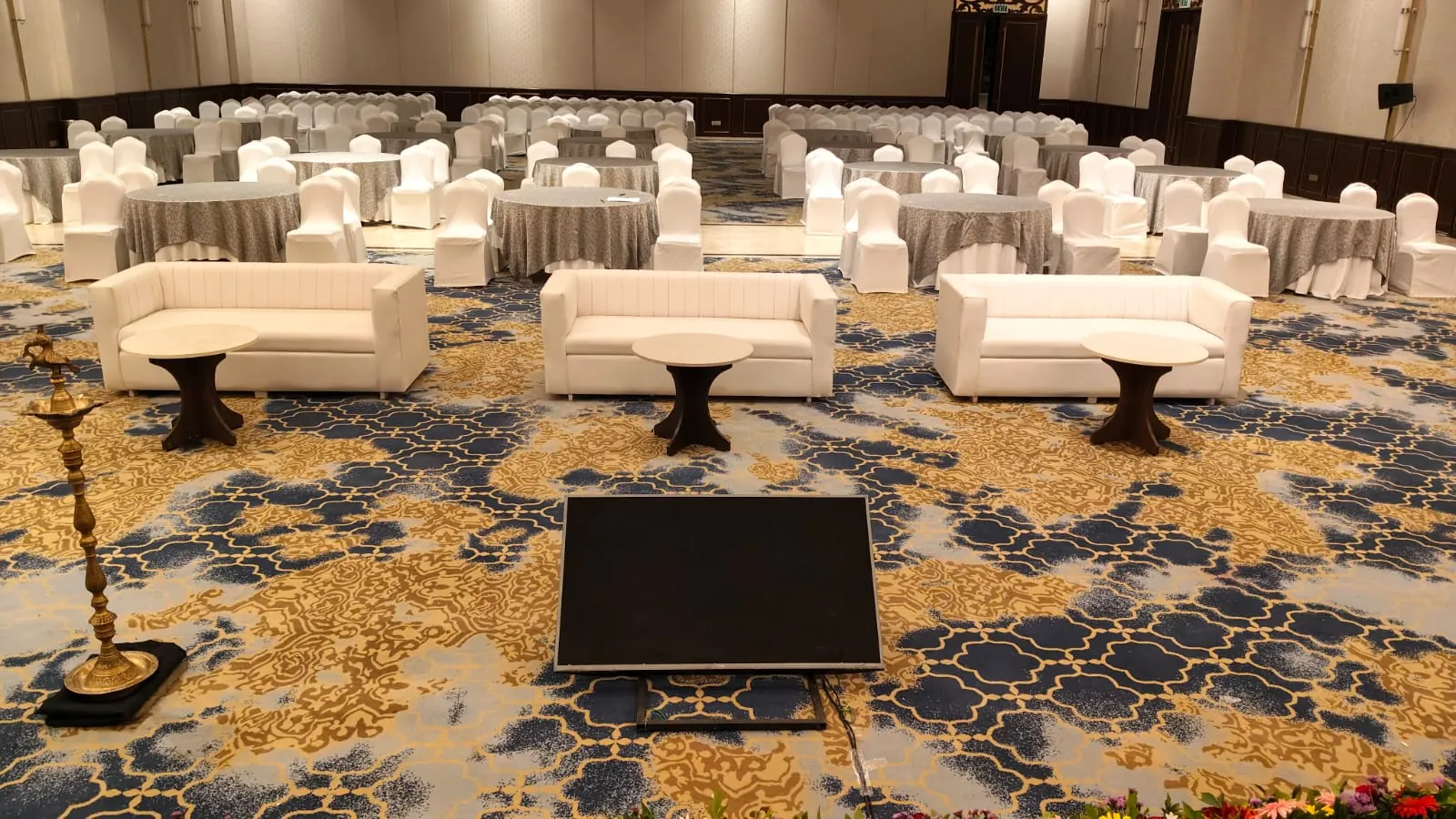 Corporate conference with attendees and stage setup