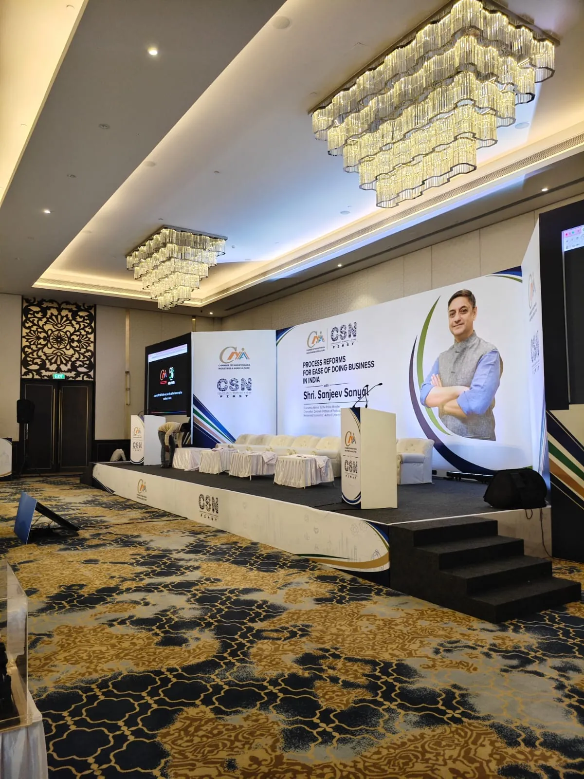 Corporate conference with attendees and stage setup