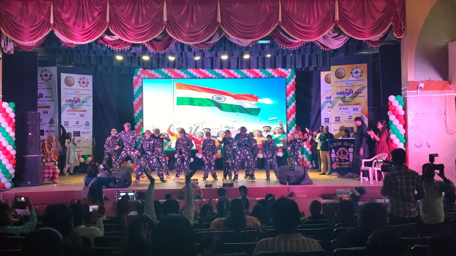 Corporate conference with attendees and stage setup