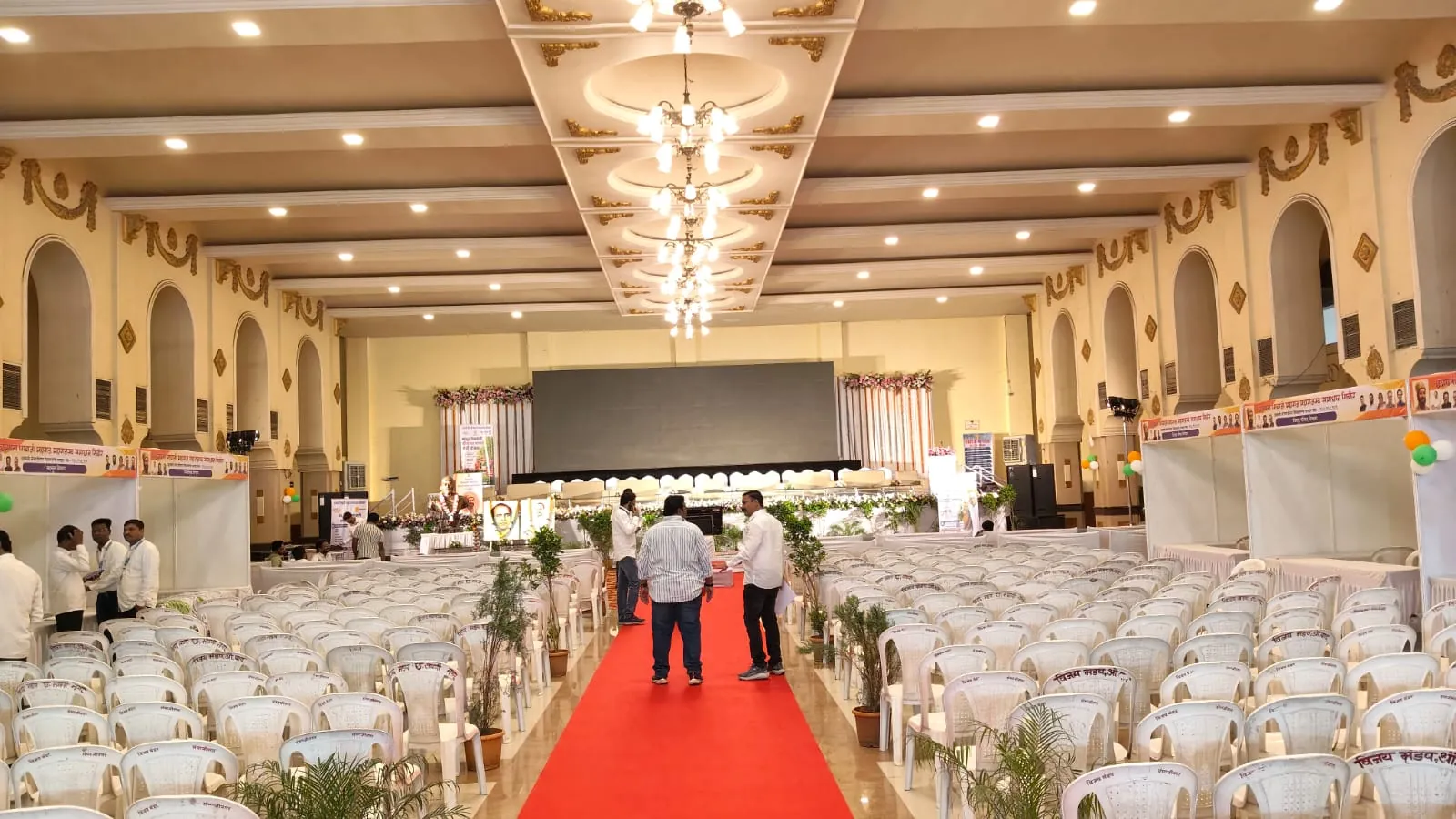 Corporate conference with attendees and stage setup