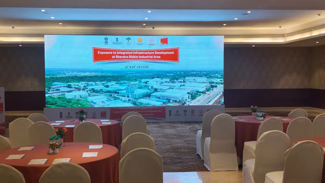 Corporate conference with attendees and stage setup
