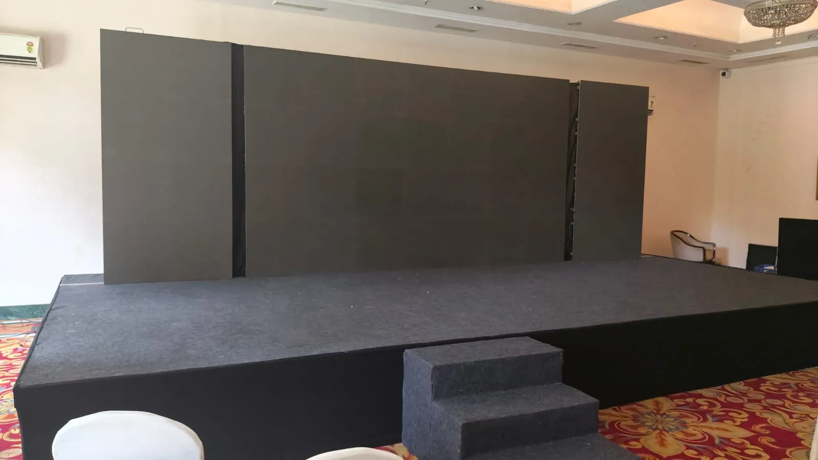 Corporate conference with attendees and stage setup