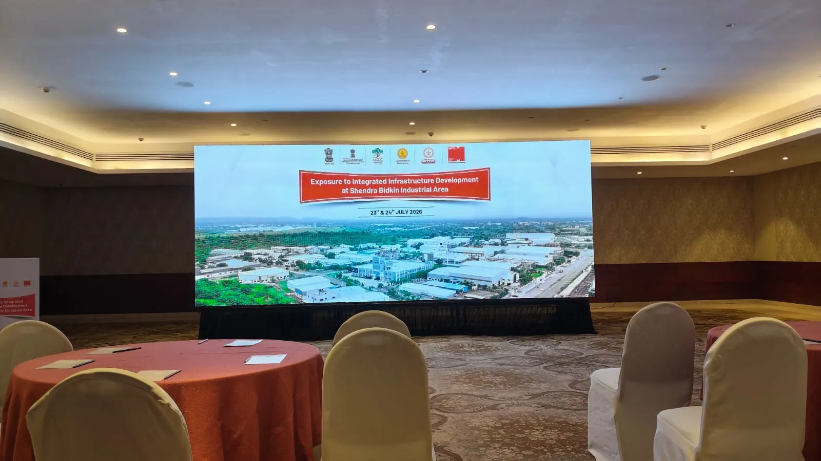 Corporate conference with attendees and stage setup