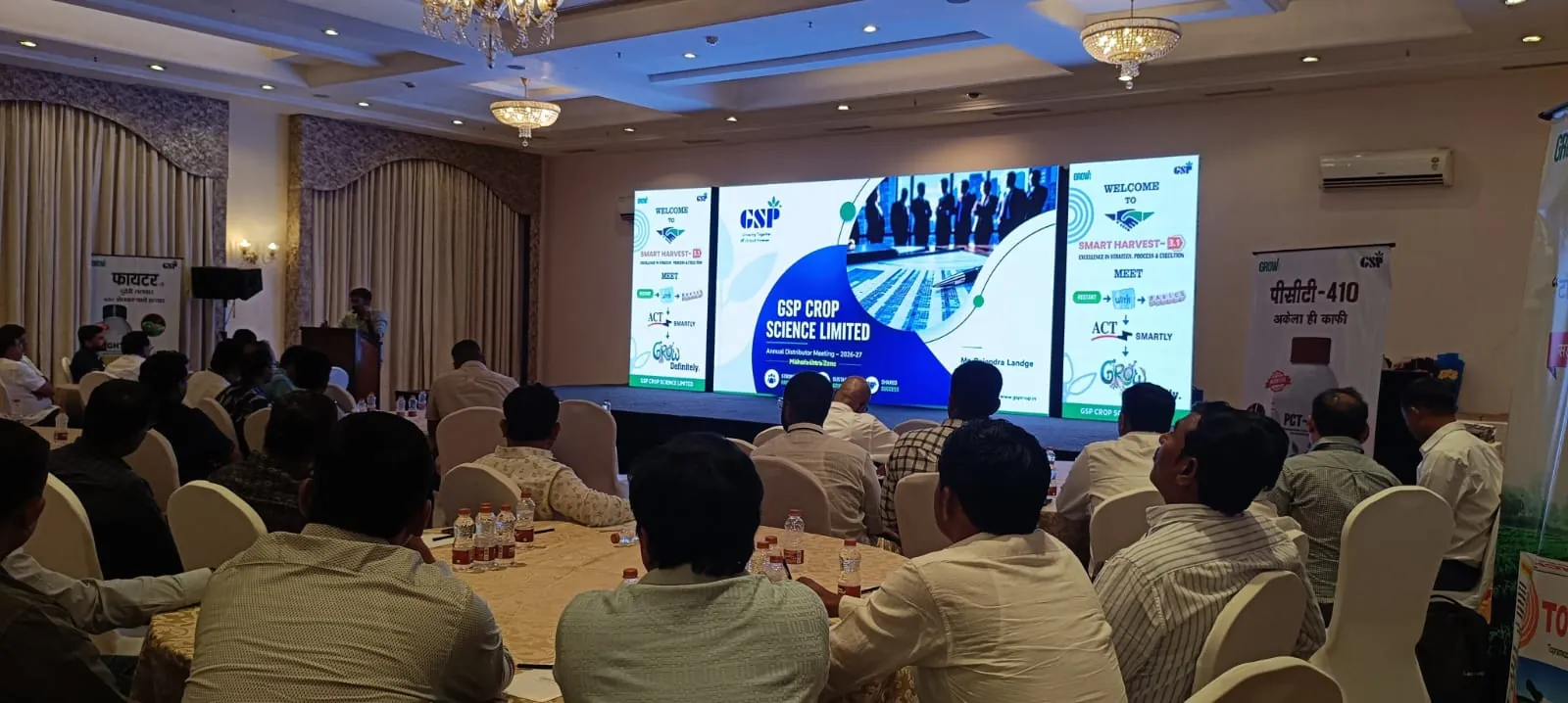 Corporate conference with attendees and stage setup