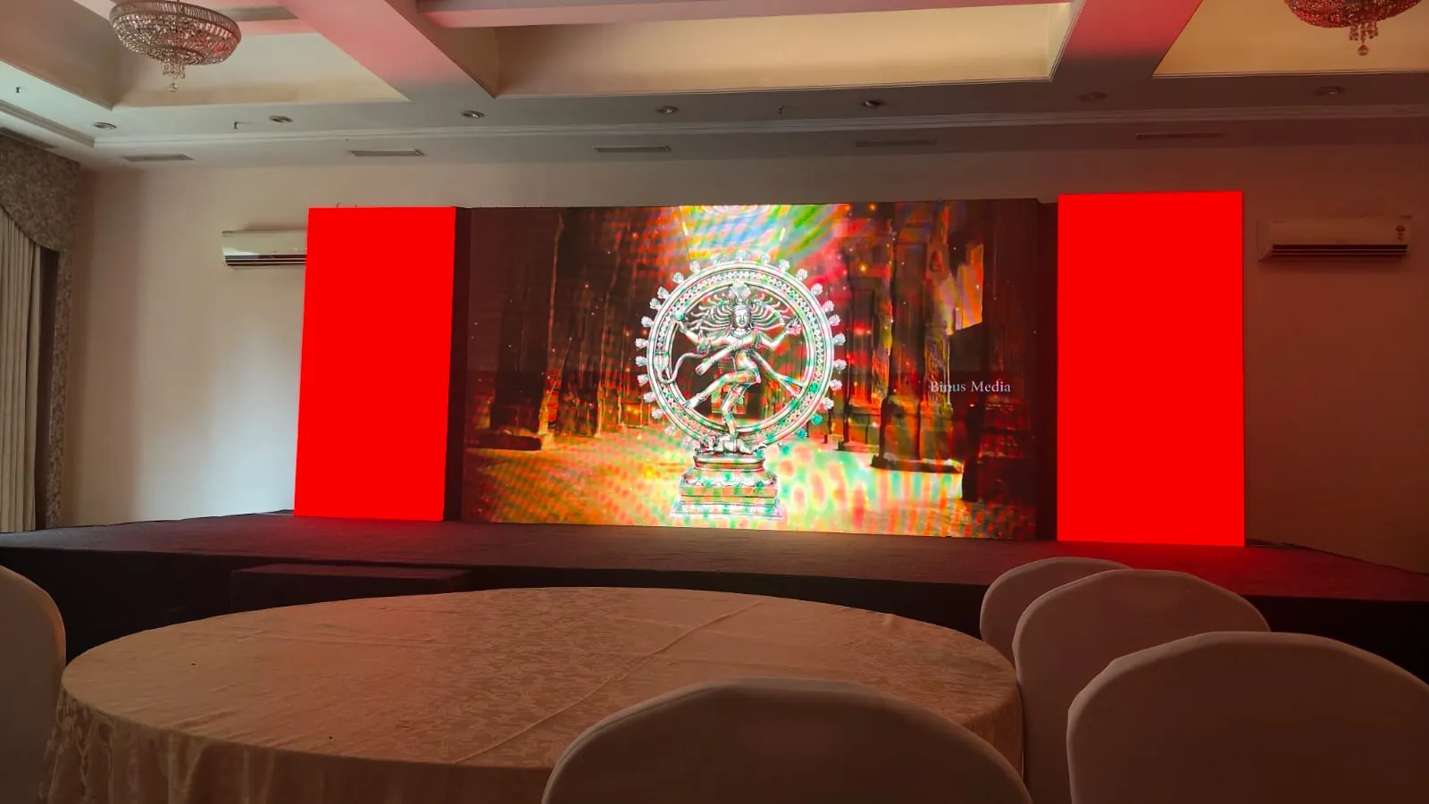Corporate conference with attendees and stage setup