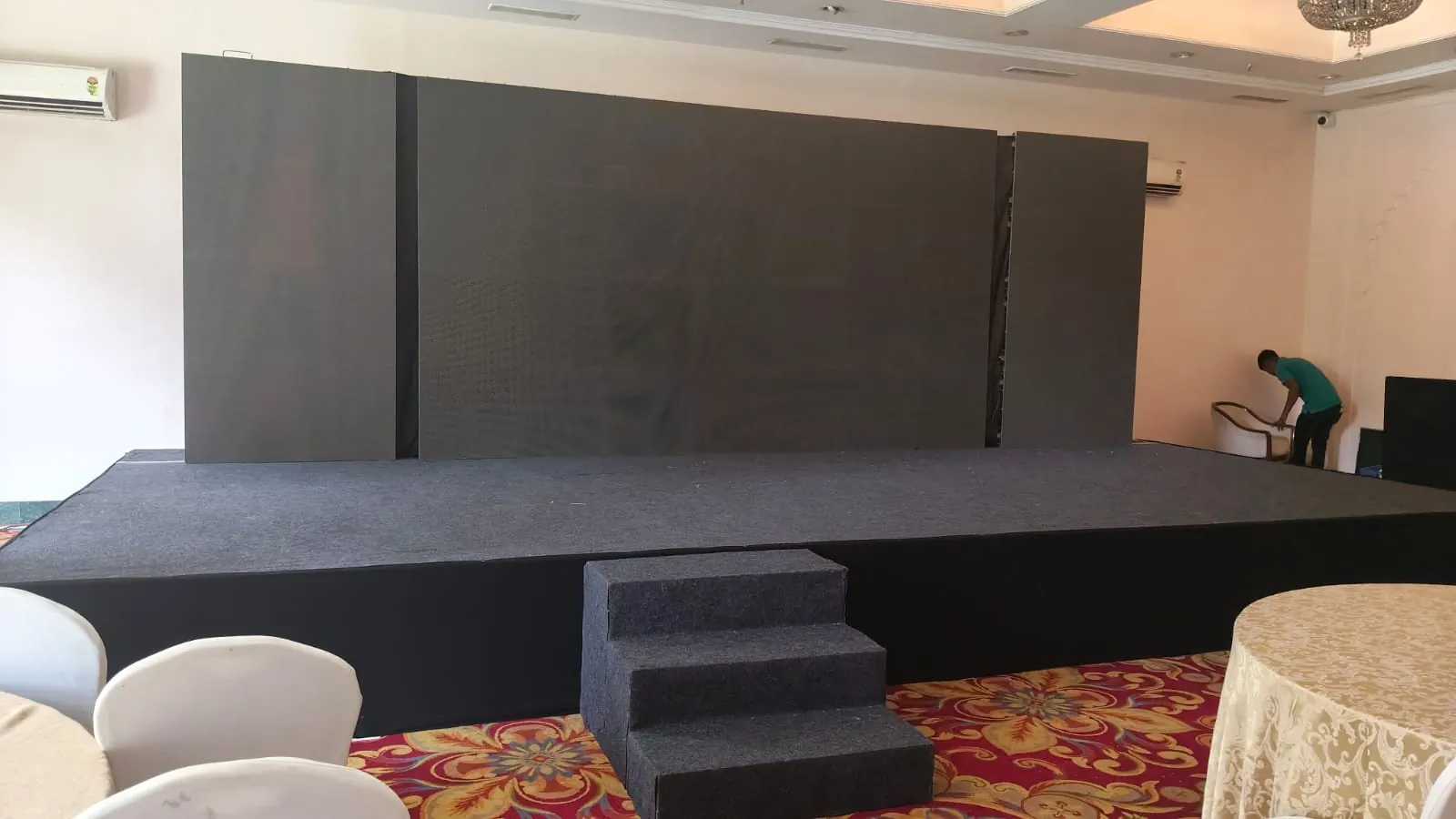 Corporate conference with attendees and stage setup