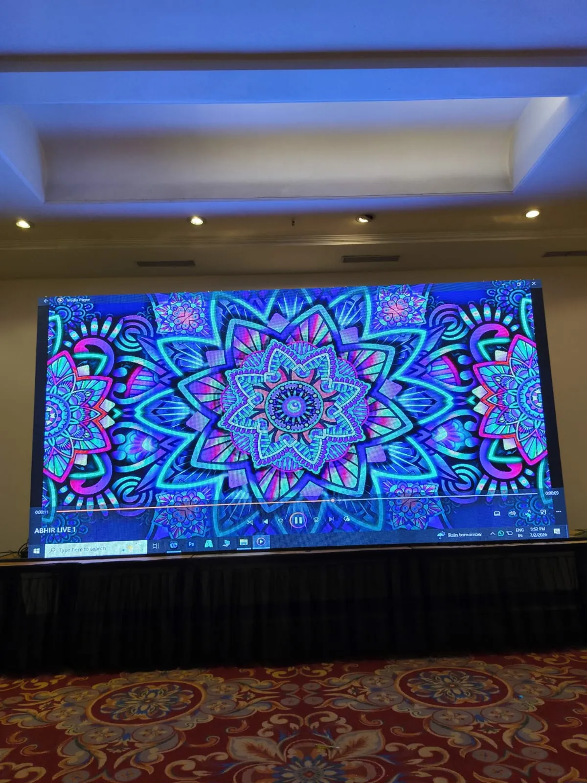 Corporate conference with attendees and stage setup