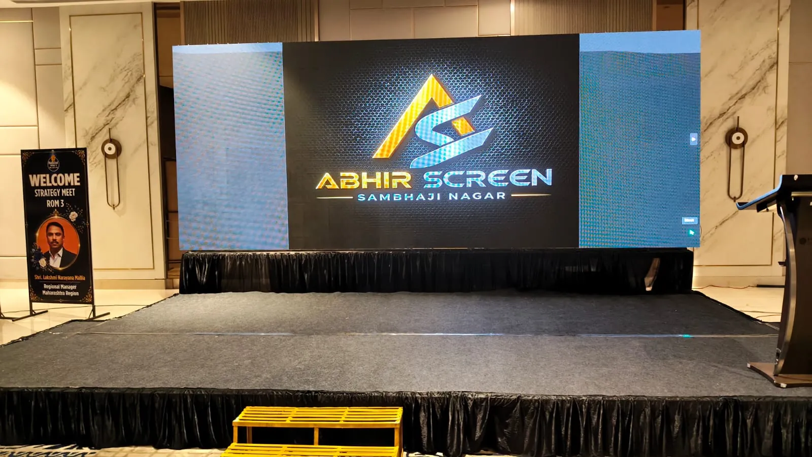 Corporate conference with attendees and stage setup