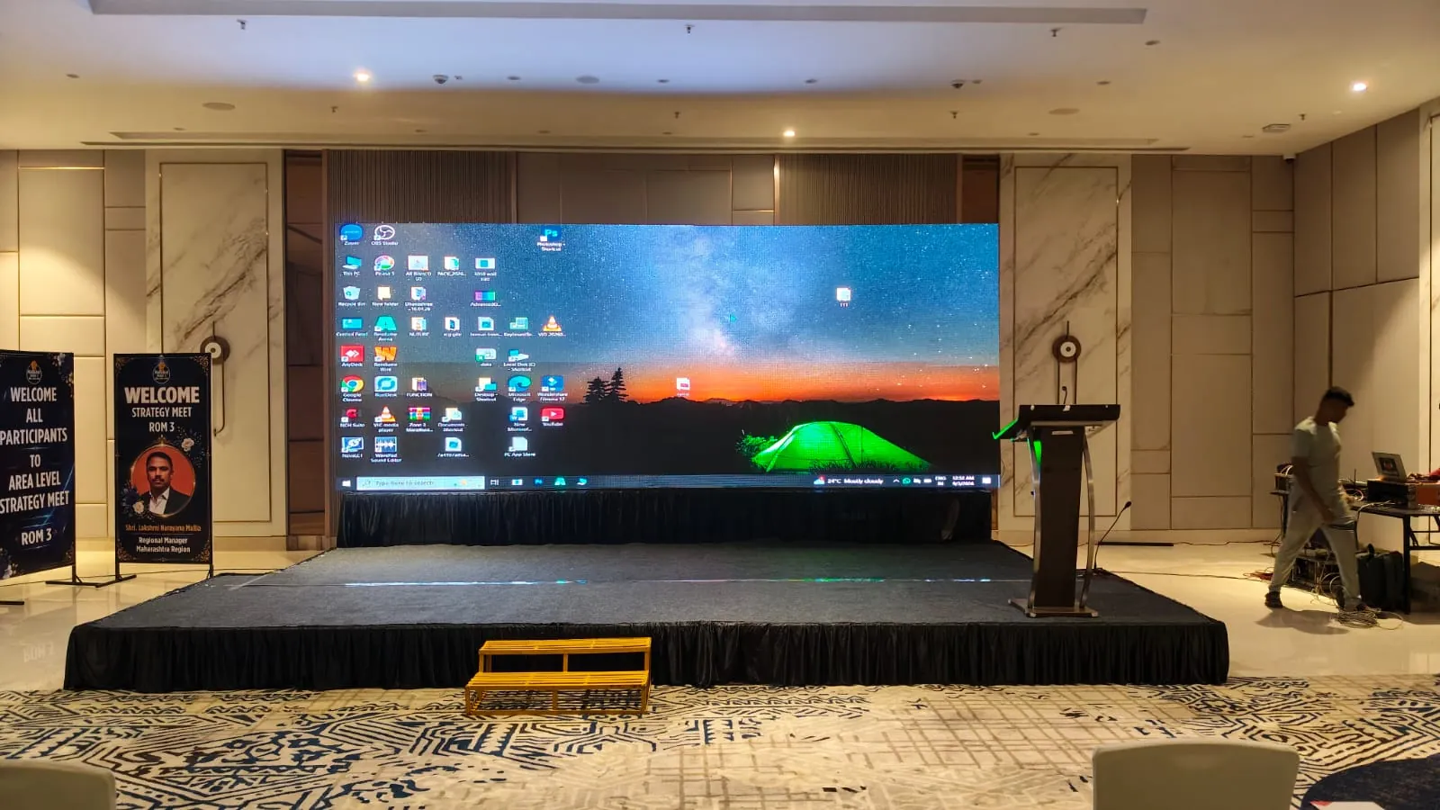 Corporate conference with attendees and stage setup