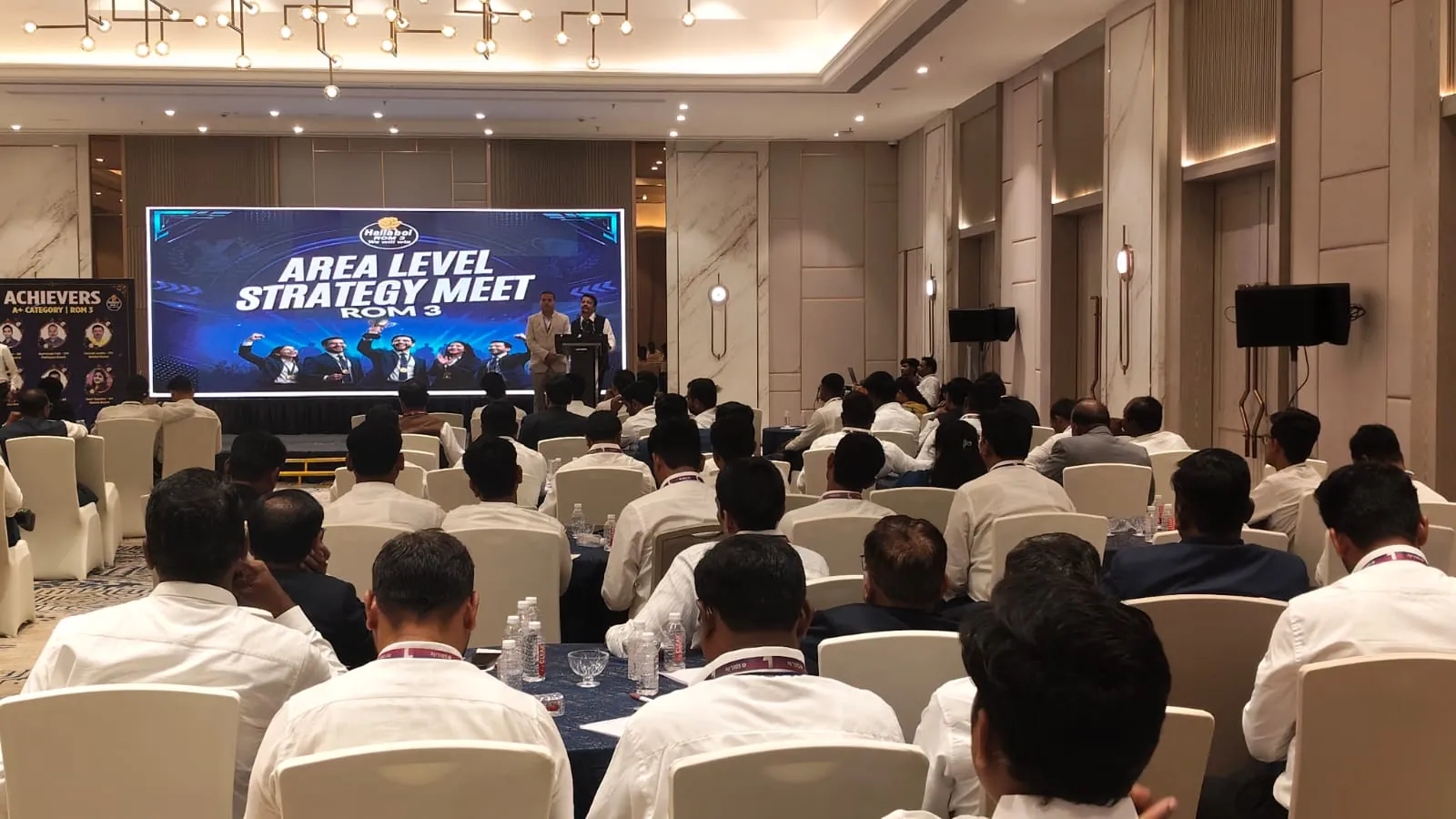 Corporate conference with attendees and stage setup