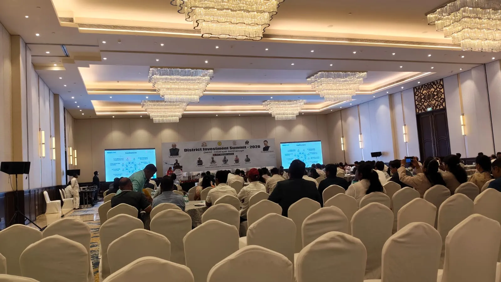 Corporate conference with attendees and stage setup